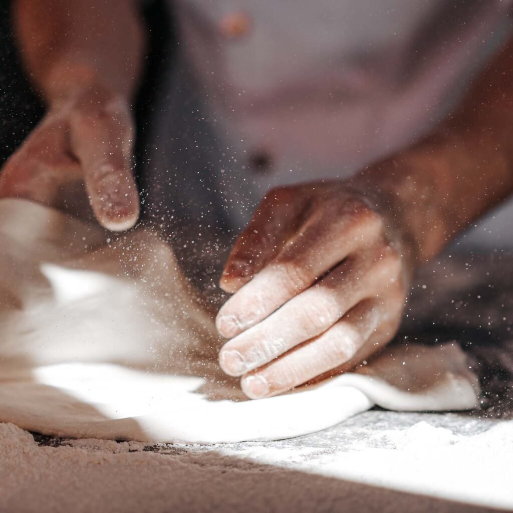 pizza-dough-hands-in-flour-99522H8.jpg